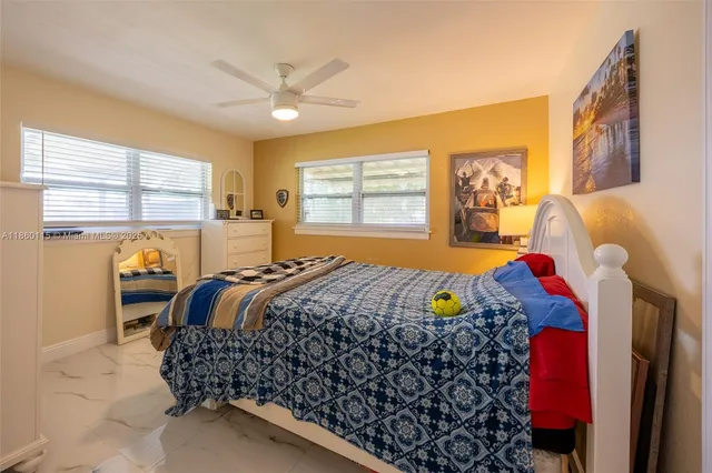 a bedroom with a bed and dresser