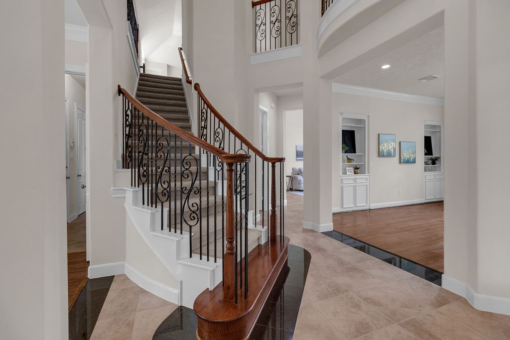 7306 Starflower Katy, TX 77494 - Photo 6 of 50 a view of entryway and hall with wooden floor