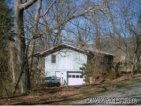 135 Caring Pl Loop Clyde, NC 28721 - Photo 1 of 2 a front view of a house with a yard