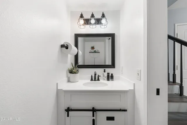 a kitchen with stainless steel appliances a stove microwave and cabinets