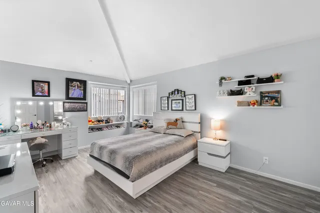 a bathroom with a sink vanity mirror and toilet