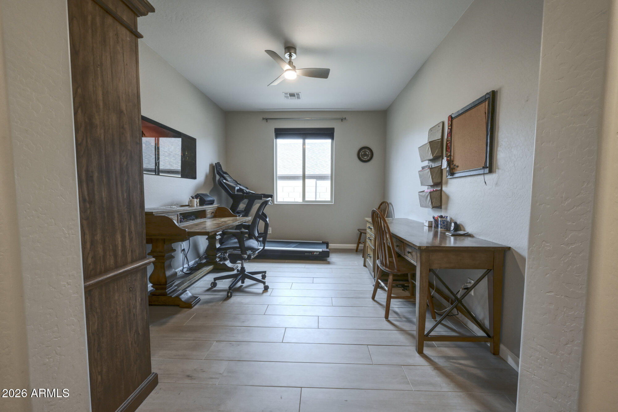 576 Whistle Stop Road Clarkdale, AZ 86324 - Photo 26 of 50 a view of a workspace with furniture and a window
