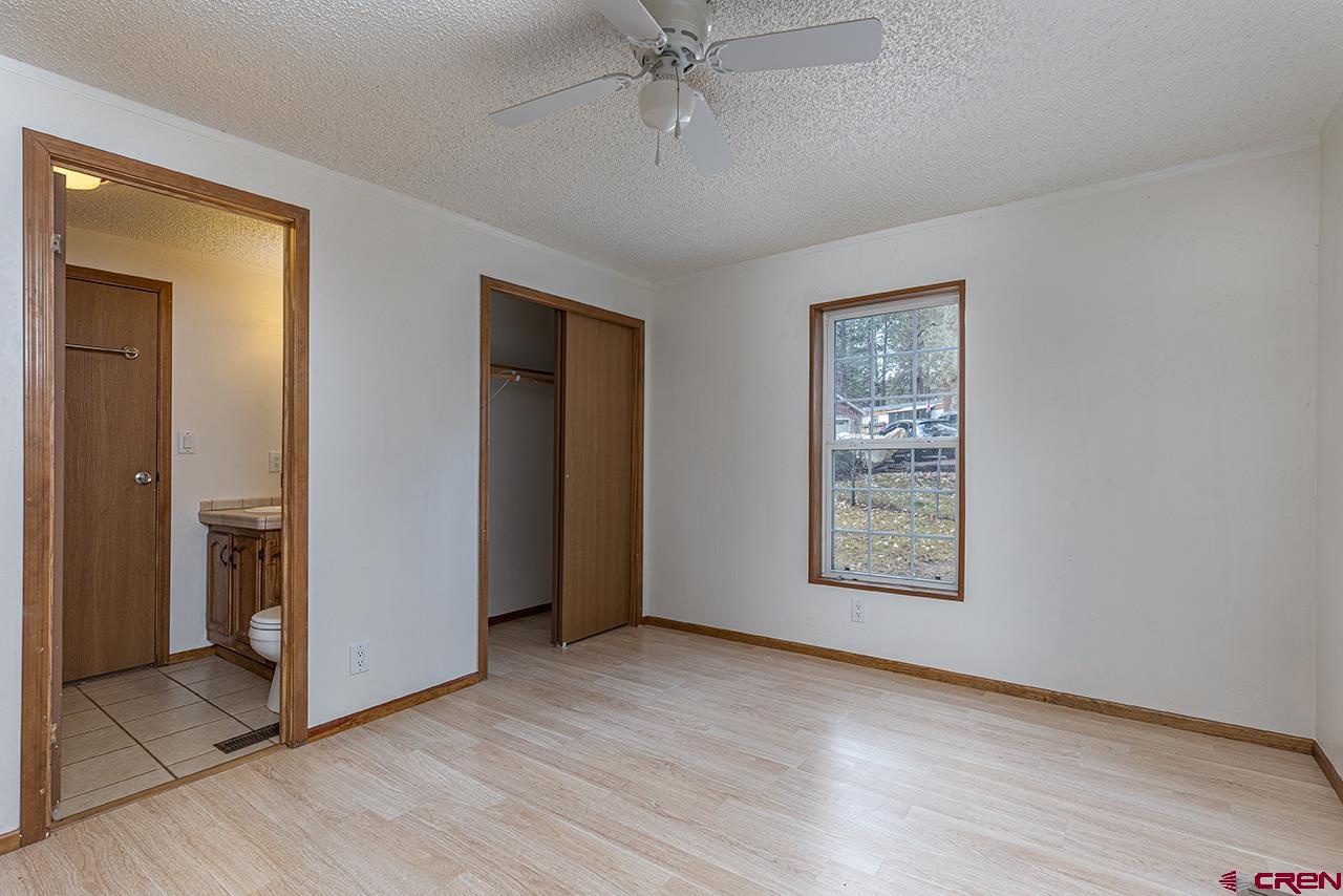 32 Hidden Lane Durango, CO 81303 - Photo 13 of 26 an empty room with windows and closet