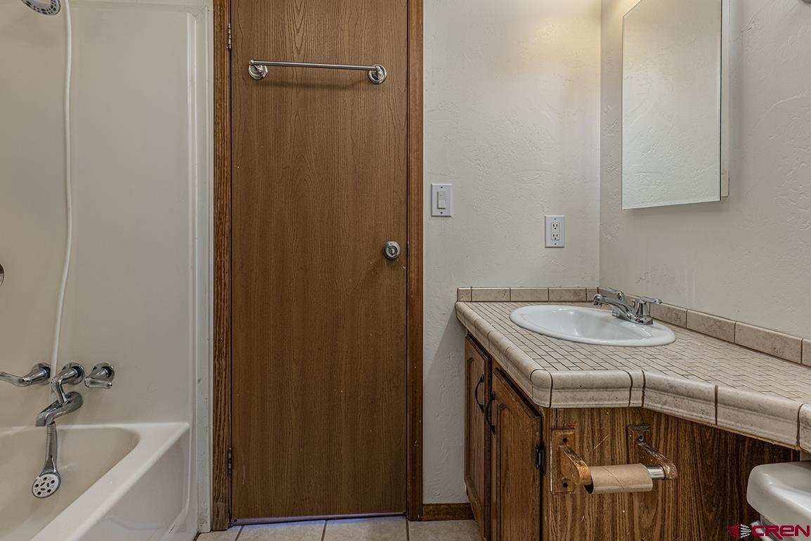 32 Hidden Lane Durango, CO 81303 - Photo 14 of 26 a bathroom with a sink and a bathtub