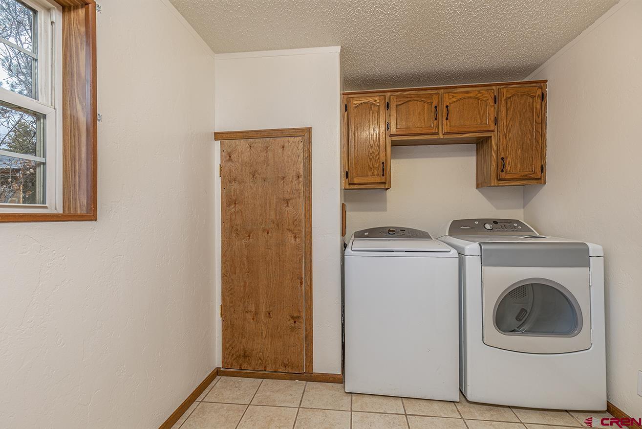 32 Hidden Lane Durango, CO 81303 - Photo 16 of 26 a utility room with dryer and washer