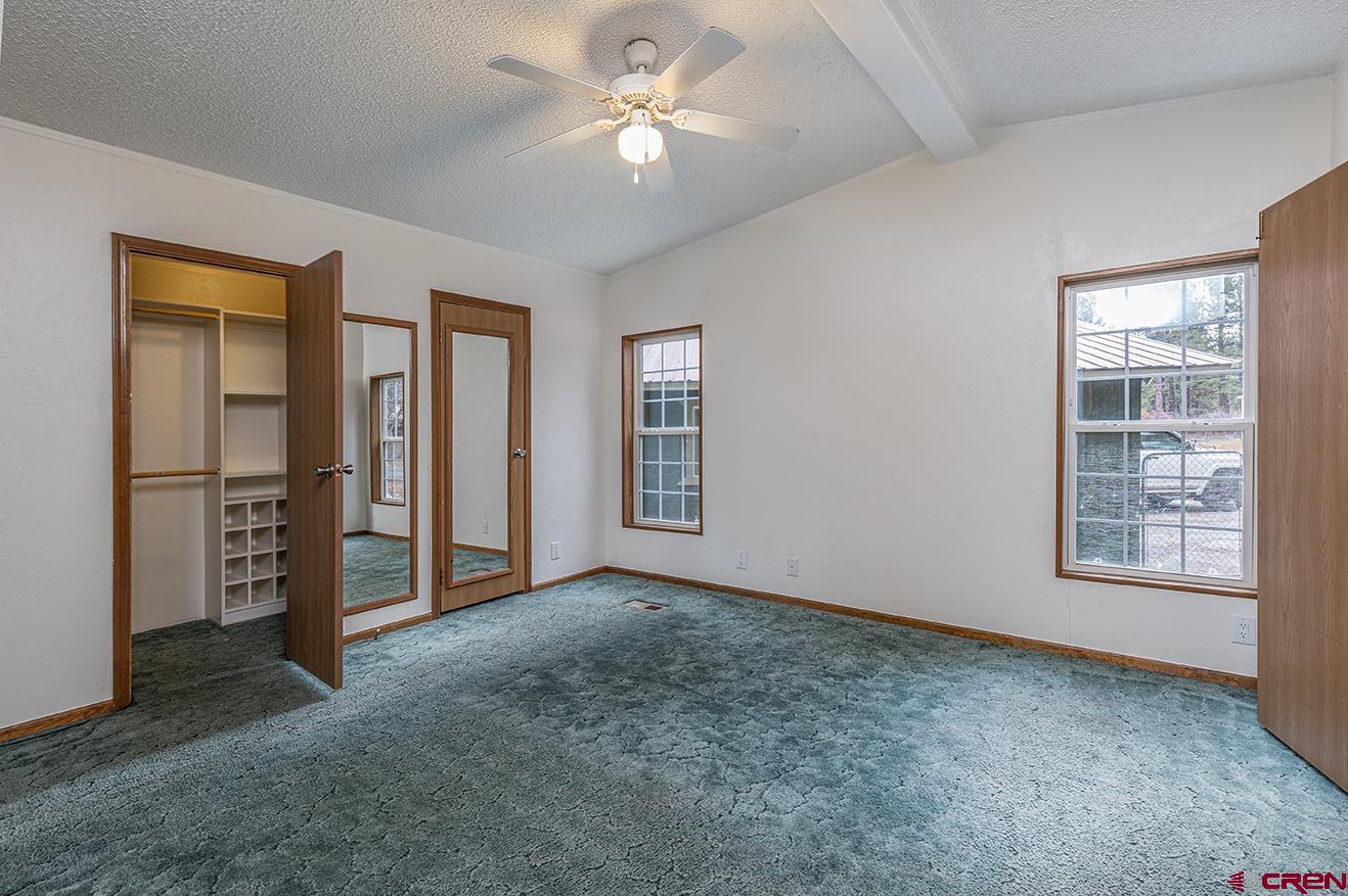 32 Hidden Lane Durango, CO 81303 - Photo 17 of 26 an empty room with windows and closet