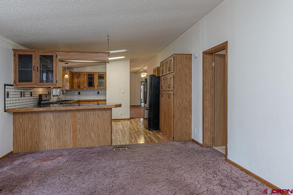 32 Hidden Lane Durango, CO 81303 - Photo 4 of 26 a kitchen with stainless steel appliances granite countertop a refrigerator and a sink