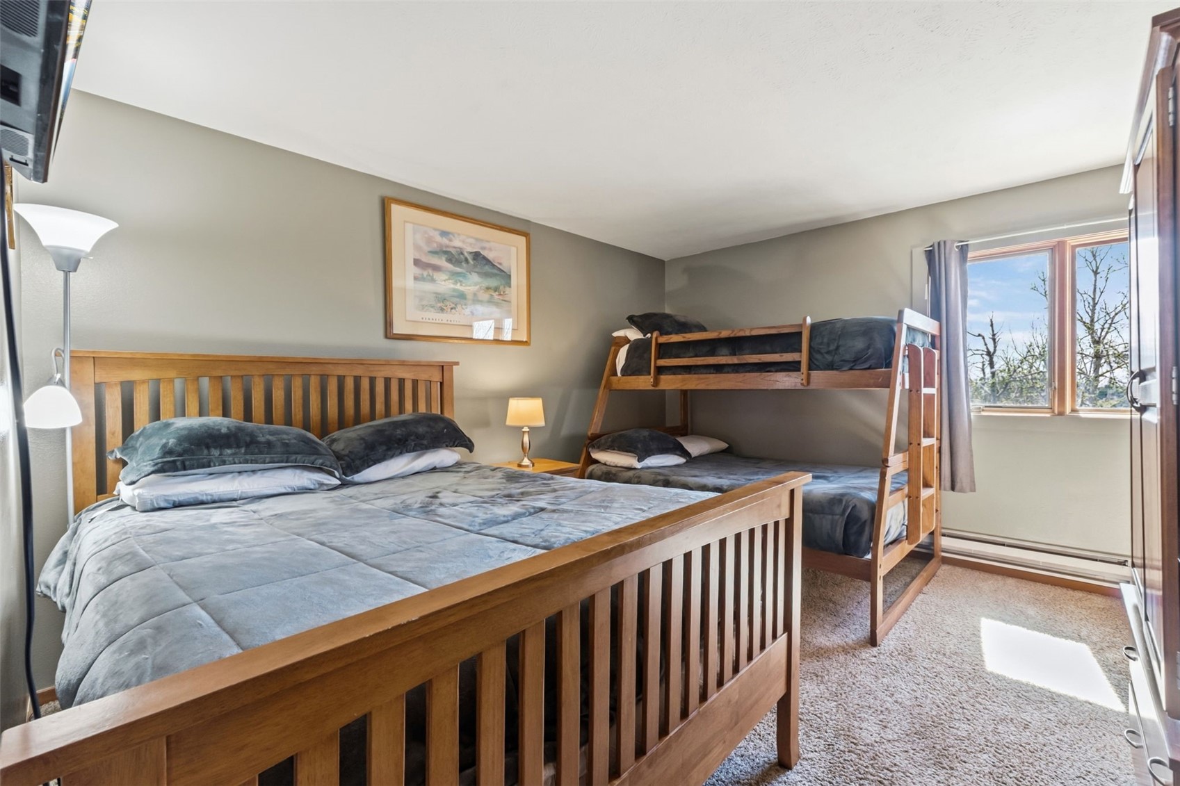 6734 Ryan Gulch Road, Unit 6734 Silverthorne, CO 80498 - Photo 20 of 33 a bedroom with a bed and a window