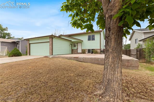 604 Wheat Field Road Fountain, CO 80817 - Photo 3 of 33 Split level home featuring a garage