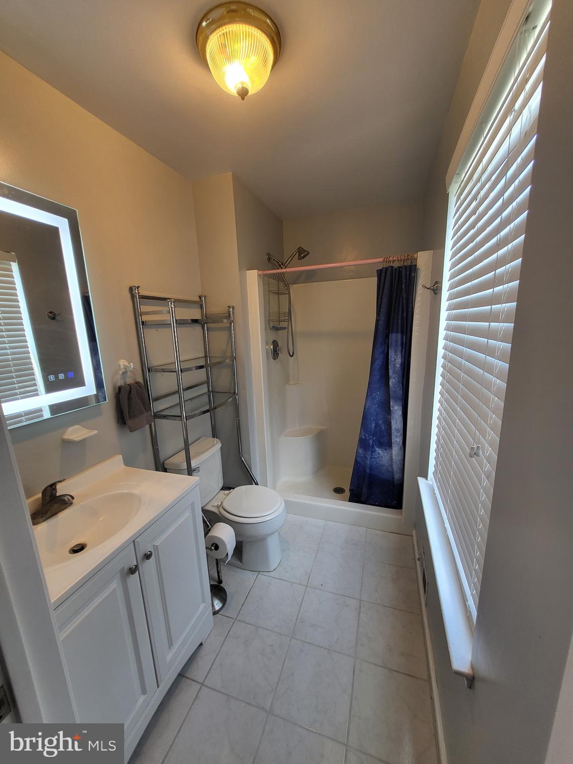 214 Chestnut Avenue Magnolia, NJ 08049 - Photo 11 of 16 a bathroom with a sink and a toilet
