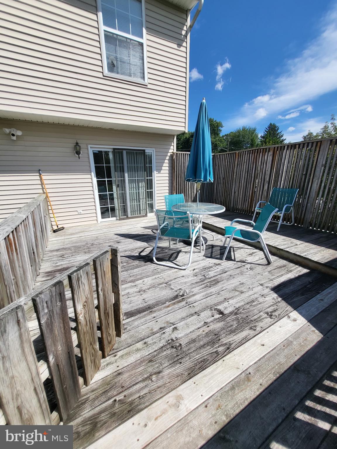 214 Chestnut Avenue Magnolia, NJ 08049 - Photo 13 of 16 a view of a deck with chairs