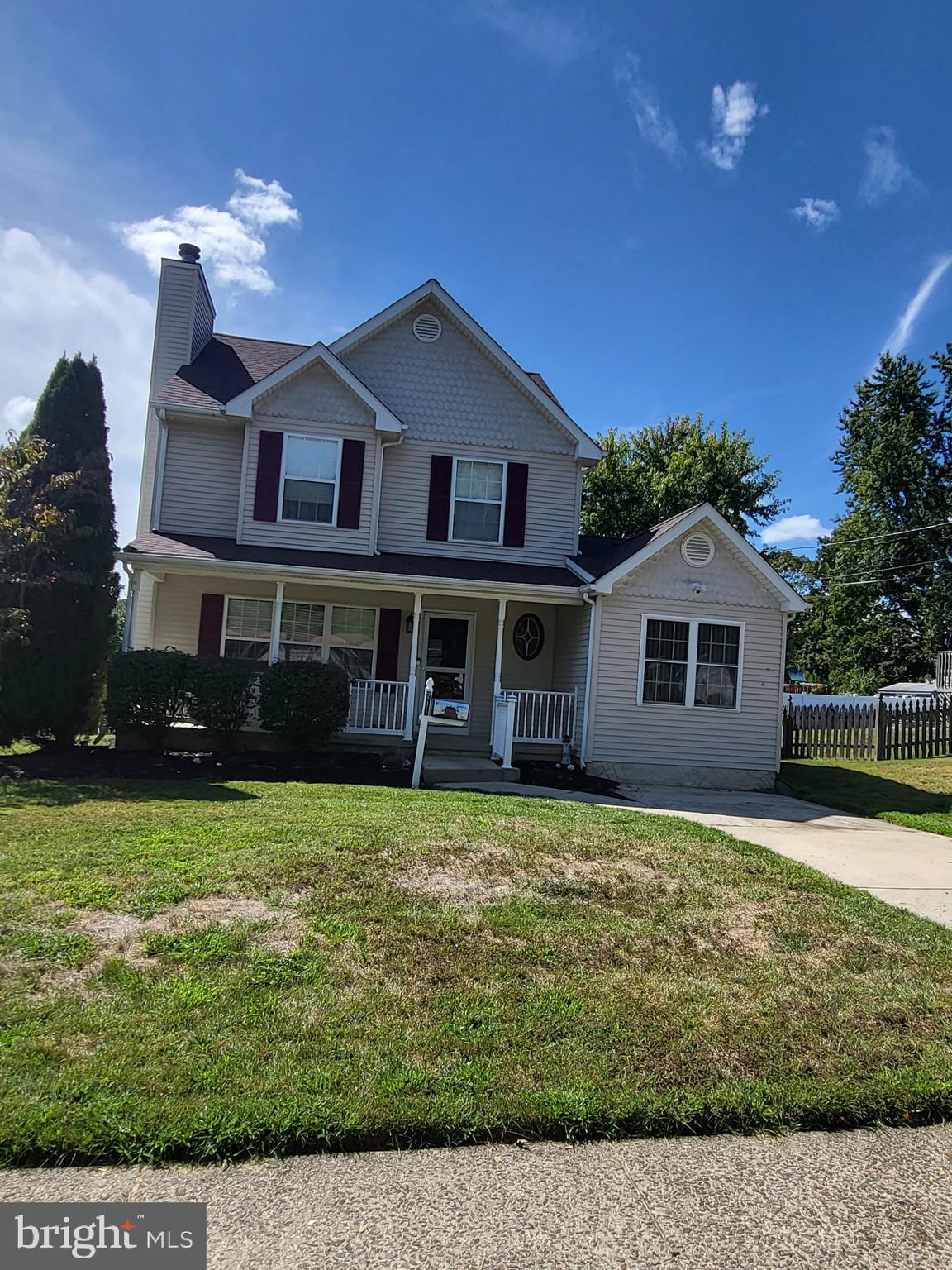 214 Chestnut Avenue Magnolia, NJ 08049 - Photo 2 of 16 a front view of a house with a garden