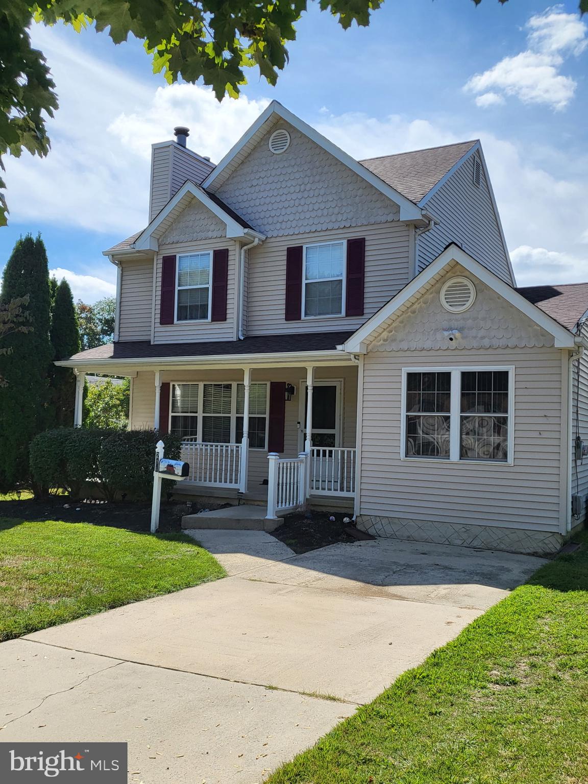 214 Chestnut Avenue Magnolia, NJ 08049 - Photo 4 of 16 a front view of a house with a yard