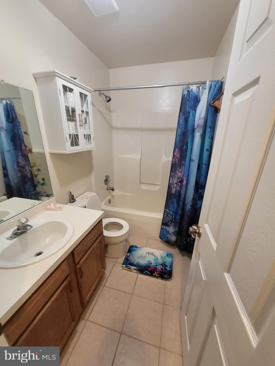 214 Chestnut Avenue Magnolia, NJ 08049 - Photo 7 of 16 a bathroom with a sink a toilet and shower