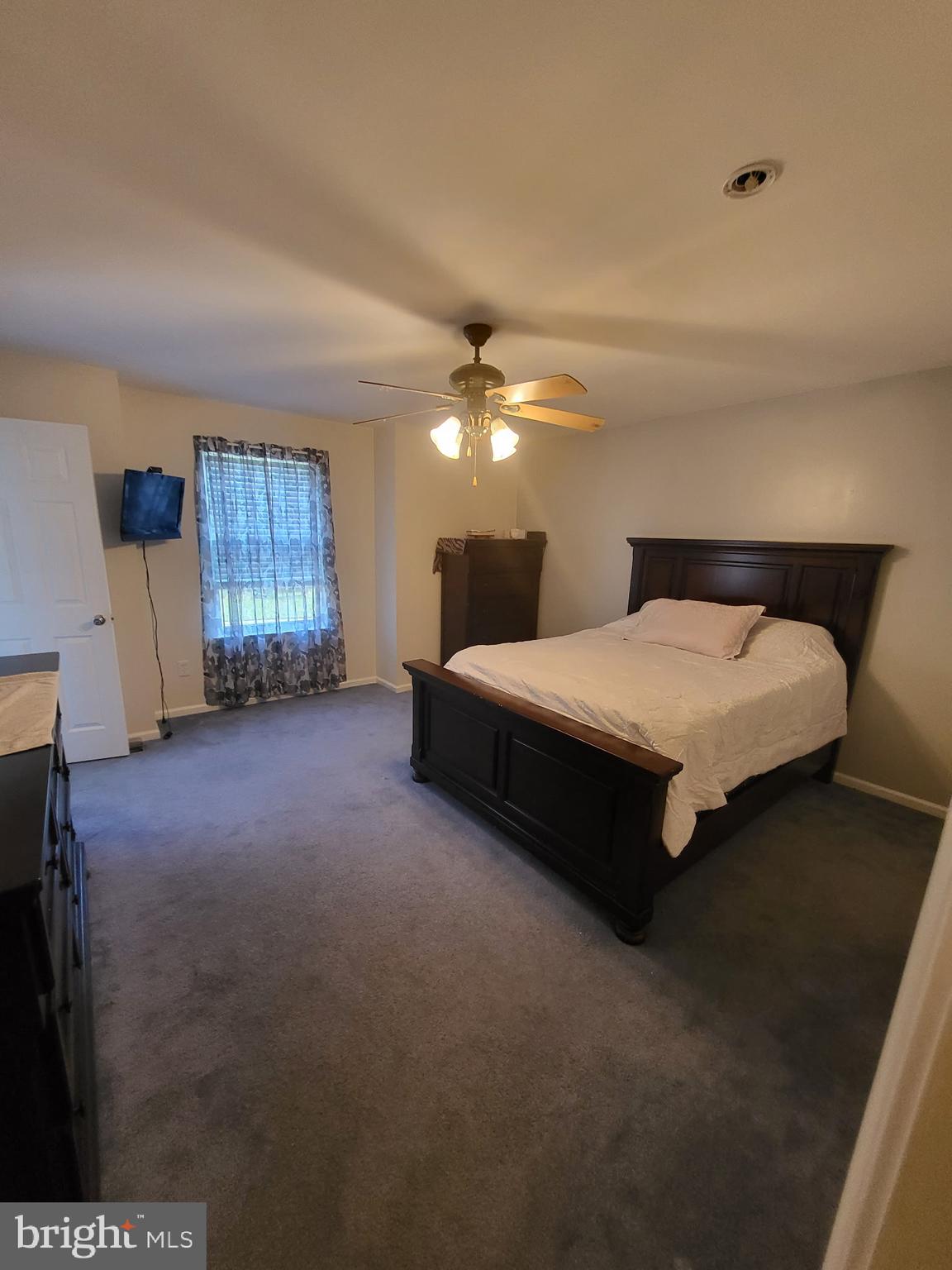 214 Chestnut Avenue Magnolia, NJ 08049 - Photo 10 of 16 a spacious bedroom with a bed and a cabinets
