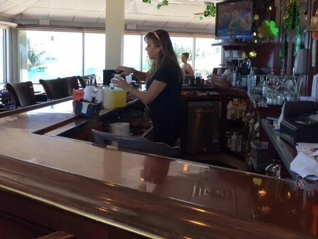 a living room with a table or chairs with wooden floor