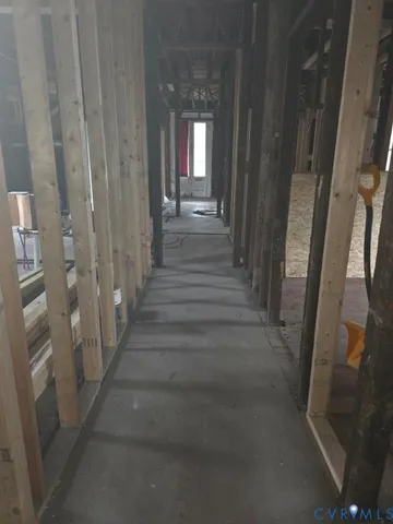 a view of a hallway view with wooden floor and staircase