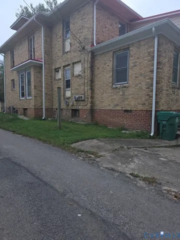 a brick building with a street