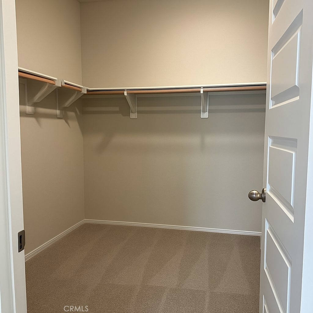 1120 Tropic Court, Unit 306 Redlands, CA 92374 - Photo 11 of 18 a view of a room with racks on the wall