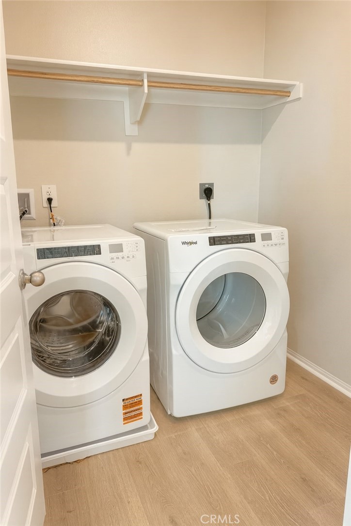 1120 Tropic Court, Unit 306 Redlands, CA 92374 - Photo 12 of 18 a utility room with dryer and washer