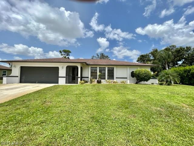 9115 Morris Road Fort Myers, FL 33967 - Photo 1 of 46 a view of a house with a backyard