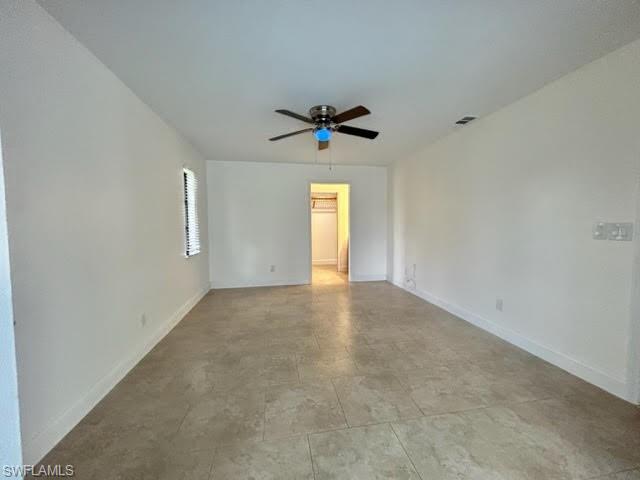 9115 Morris Road Fort Myers, FL 33967 - Photo 18 of 46 an empty room with a window and a ceiling fan