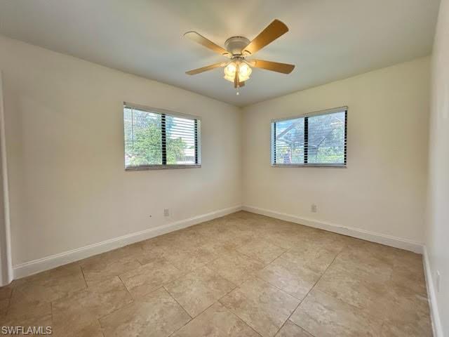 9115 Morris Road Fort Myers, FL 33967 - Photo 20 of 46 a view of an empty room with a window