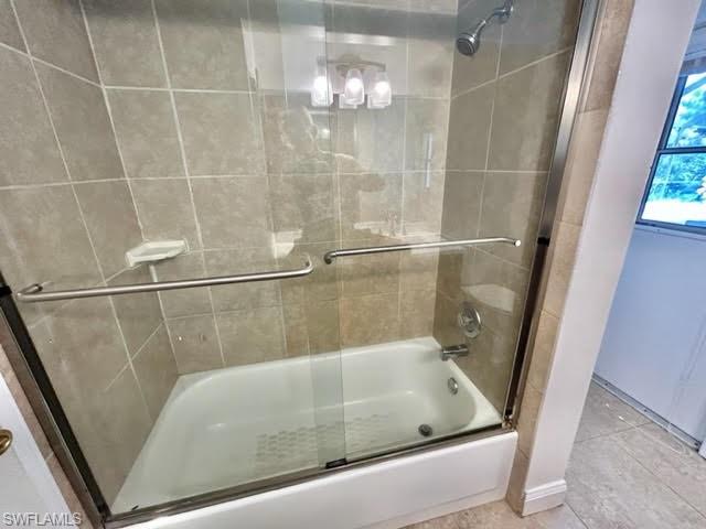 9115 Morris Road Fort Myers, FL 33967 - Photo 25 of 46 a bathroom with a bath tub