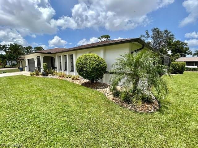 9115 Morris Road Fort Myers, FL 33967 - Photo 3 of 46 a view of a house with a yard