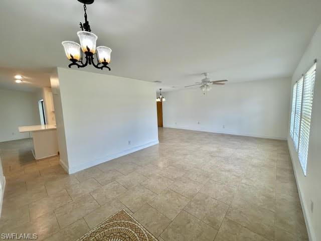 9115 Morris Road Fort Myers, FL 33967 - Photo 40 of 46 a view of a room with a hanging light and kitchen