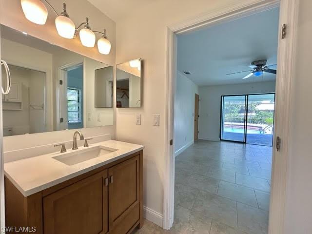 9115 Morris Road Fort Myers, FL 33967 - Photo 43 of 46 a bathroom with a sink vanity and mirror