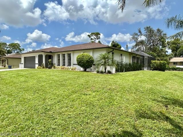 9115 Morris Road Fort Myers, FL 33967 - Photo 5 of 46 a front view of house with yard and green space