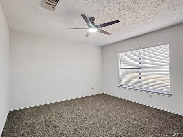 an empty room with closet area