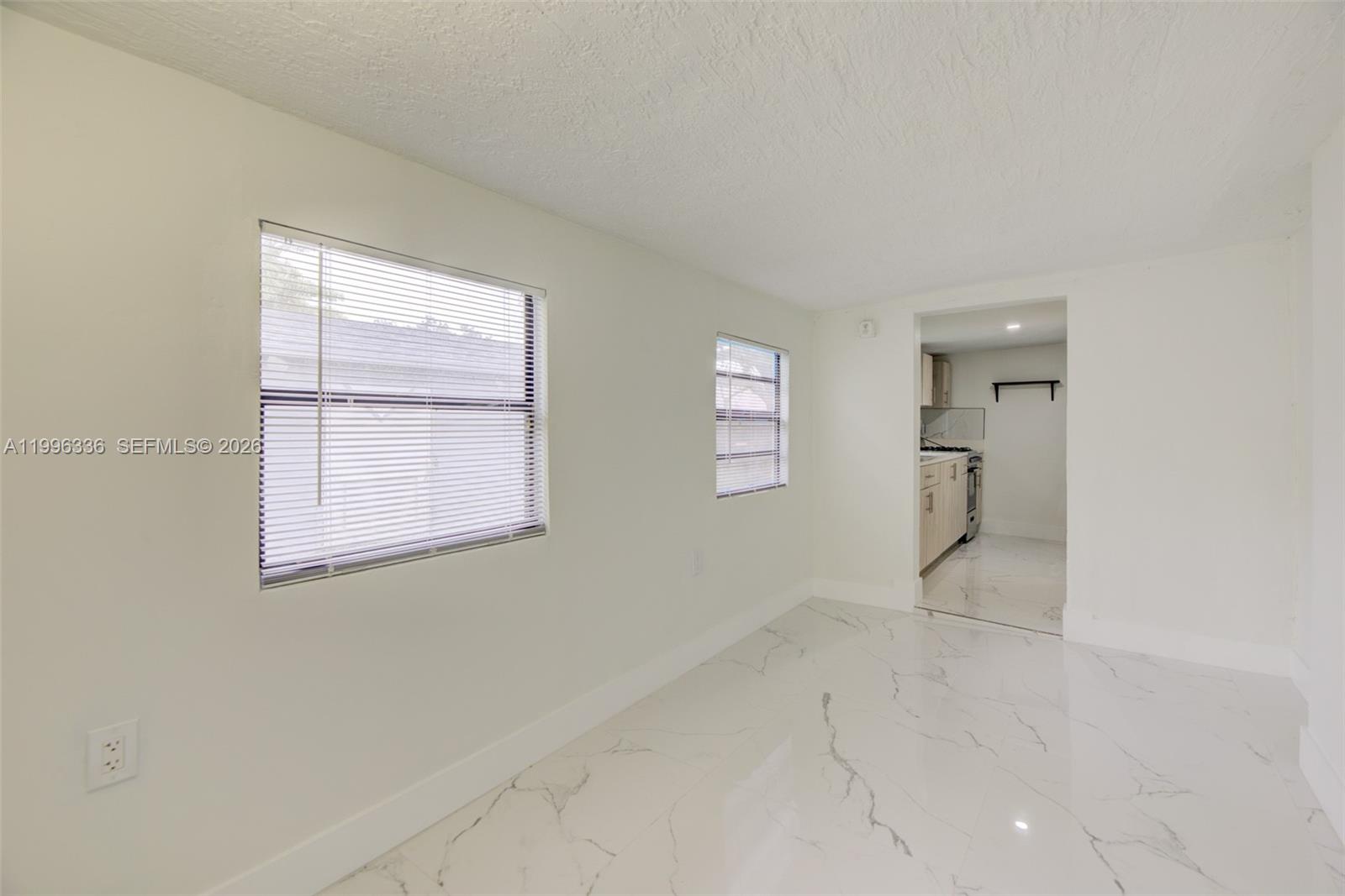 20201 Southwest 117th Court Miami, FL 33177 - Photo 17 of 18 an empty room with windows and entrance