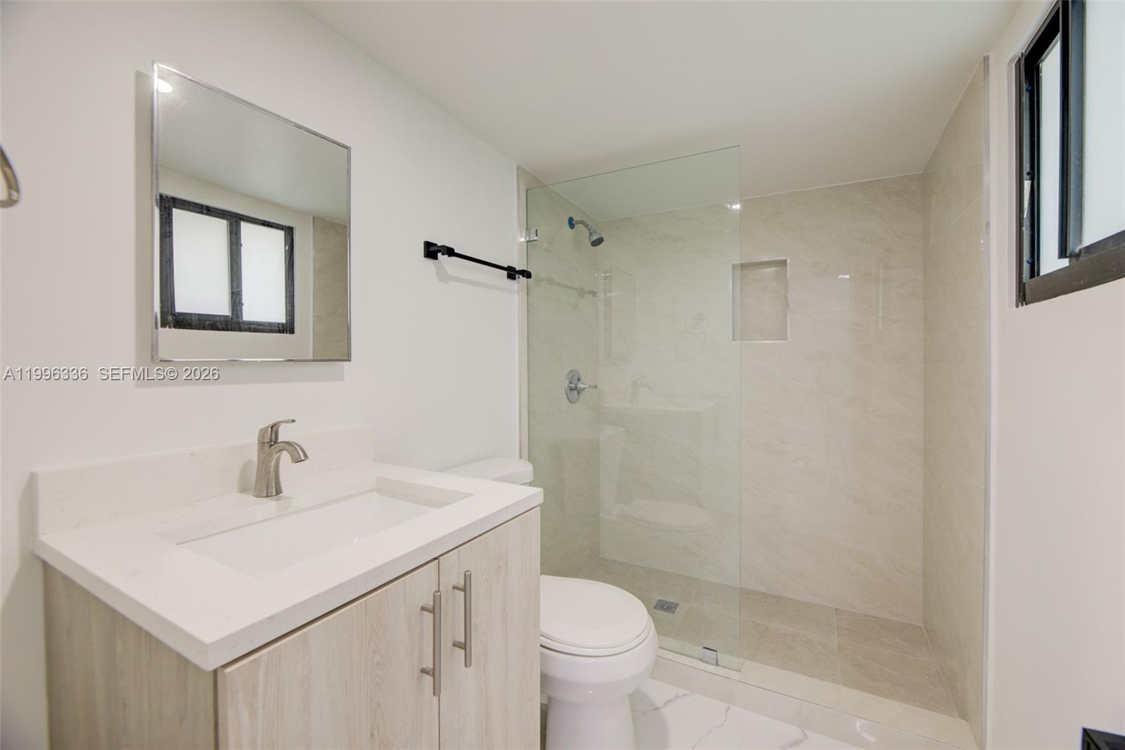 20201 Southwest 117th Court Miami, FL 33177 - Photo 5 of 18 a bathroom with a sink toilet and shower