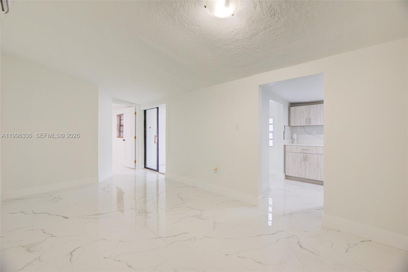 20201 Southwest 117th Court Miami, FL 33177 - Photo 10 of 18 an empty room with cabinet and mirrors