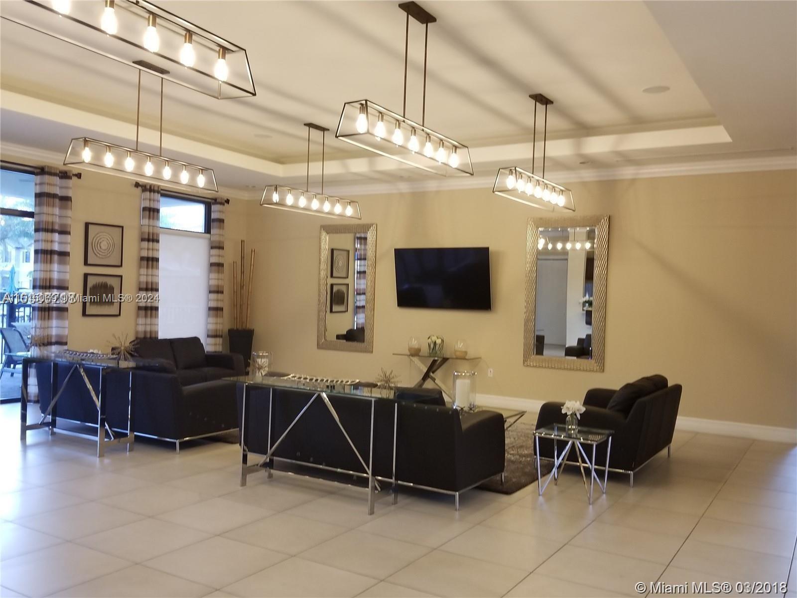 15053 Southwest 115th Terrace Miami, FL 33196 - Photo 12 of 29 a living room with furniture a flat screen tv and kitchen view