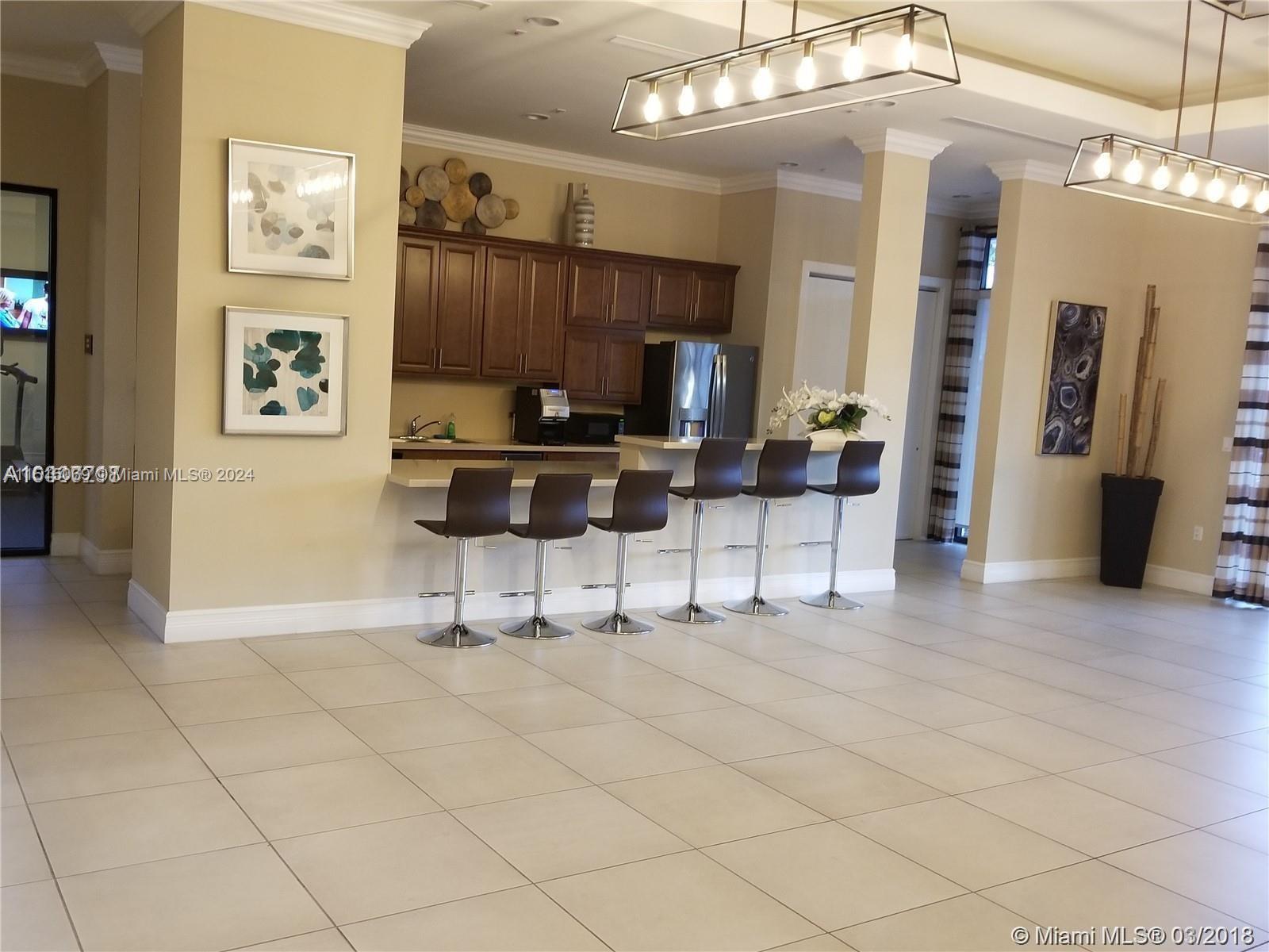 15053 Southwest 115th Terrace Miami, FL 33196 - Photo 13 of 29 a view of a entryway with furniture and chandelier