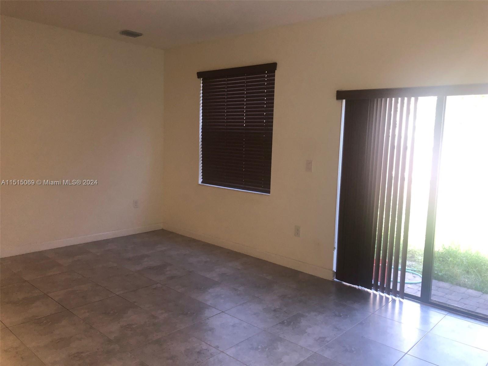 15053 Southwest 115th Terrace Miami, FL 33196 - Photo 17 of 29 an empty room with windows