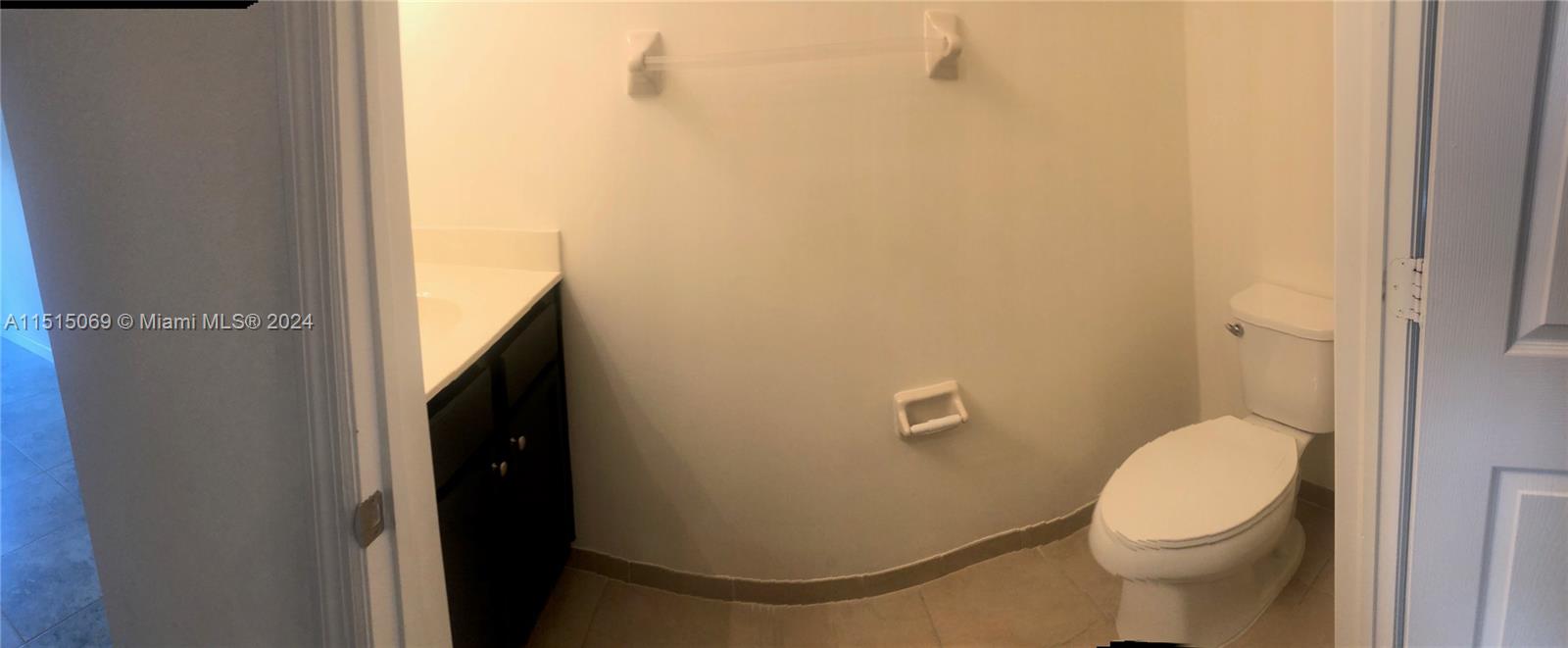 15053 Southwest 115th Terrace Miami, FL 33196 - Photo 19 of 29 a bathroom with a toilet