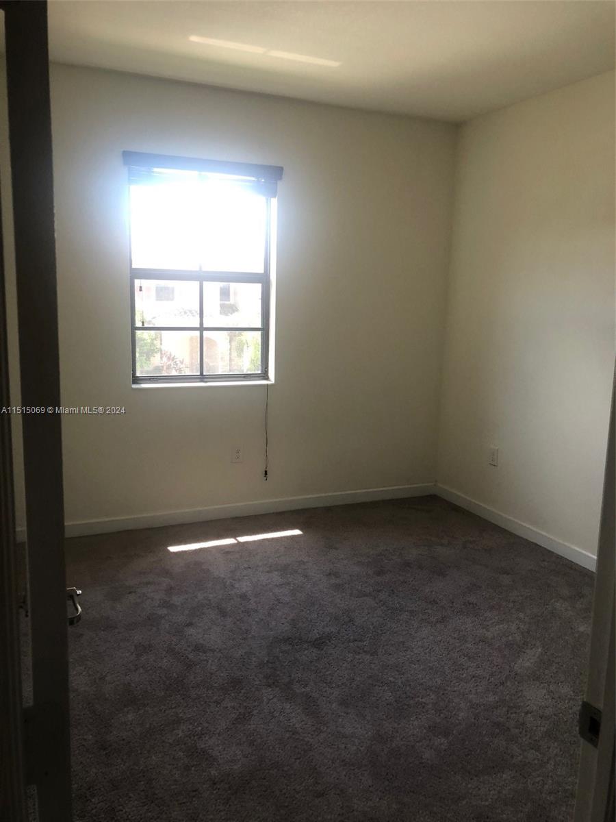 15053 Southwest 115th Terrace Miami, FL 33196 - Photo 20 of 29 an empty room with a window