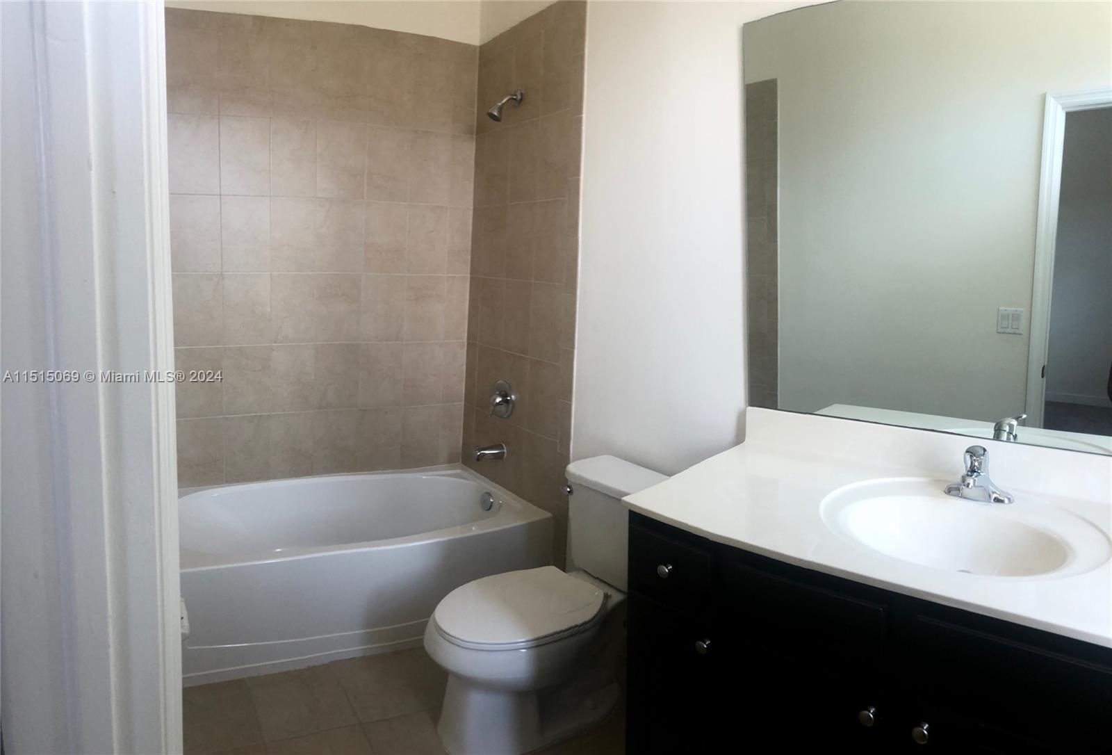 15053 Southwest 115th Terrace Miami, FL 33196 - Photo 22 of 29 a bathroom with a sink and a toilet