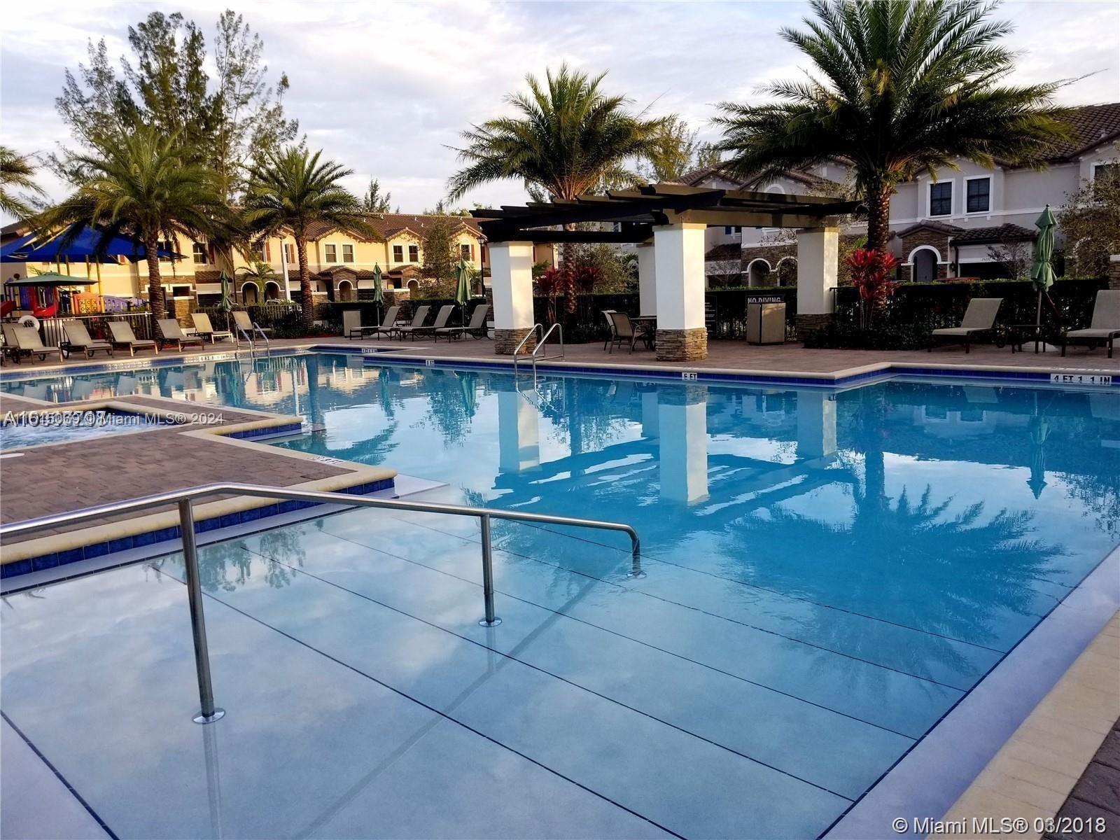 15053 Southwest 115th Terrace Miami, FL 33196 - Photo 8 of 29 a view of swimming pool with outdoor seating
