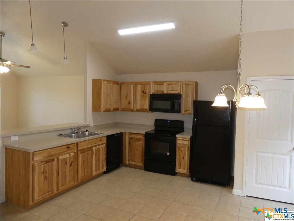 2455 Golf Drive Spring Branch, TX 78070 - Photo 12 of 24 a kitchen with stainless steel appliances granite countertop a refrigerator and a sink