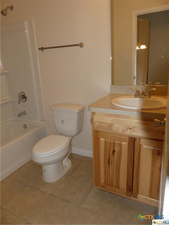 2455 Golf Drive Spring Branch, TX 78070 - Photo 16 of 24 a bathroom with a granite countertop sink a toilet mirror and shower