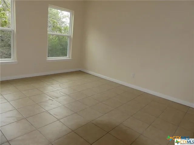 an empty room with windows
