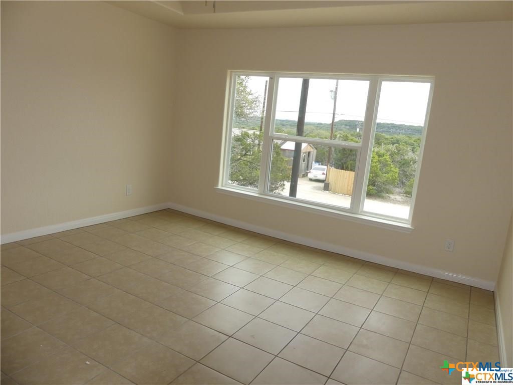 2455 Golf Drive Spring Branch, TX 78070 - Photo 19 of 24 a view of an empty room with a window