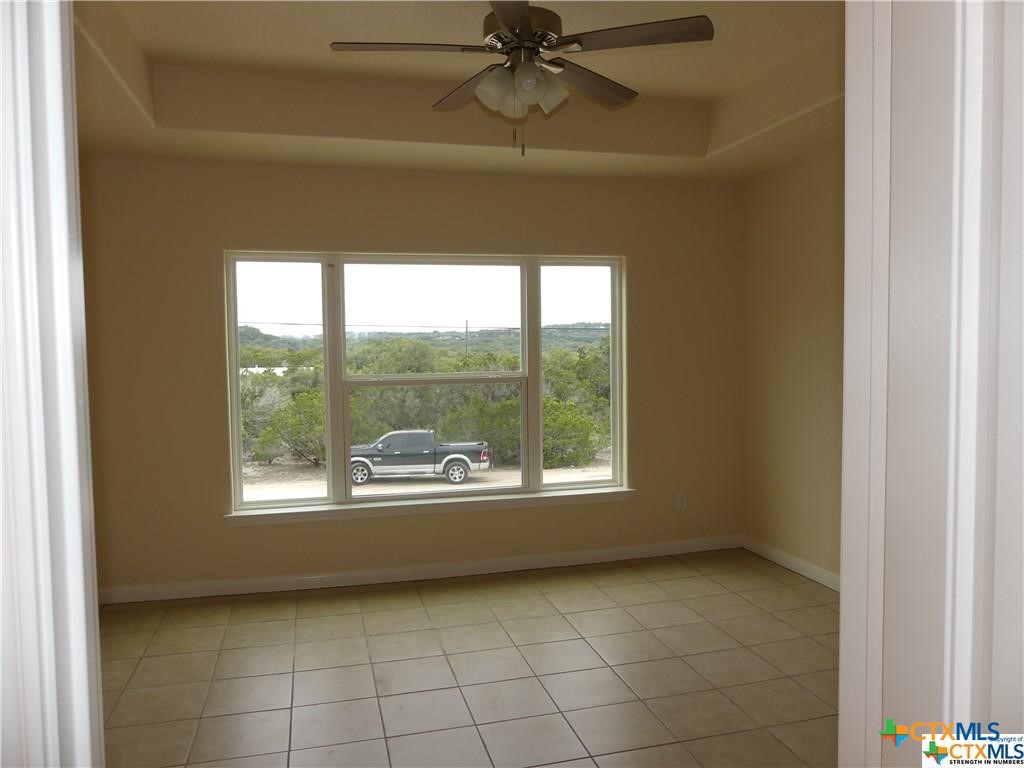 2455 Golf Drive Spring Branch, TX 78070 - Photo 21 of 24 a view of an empty room with a window