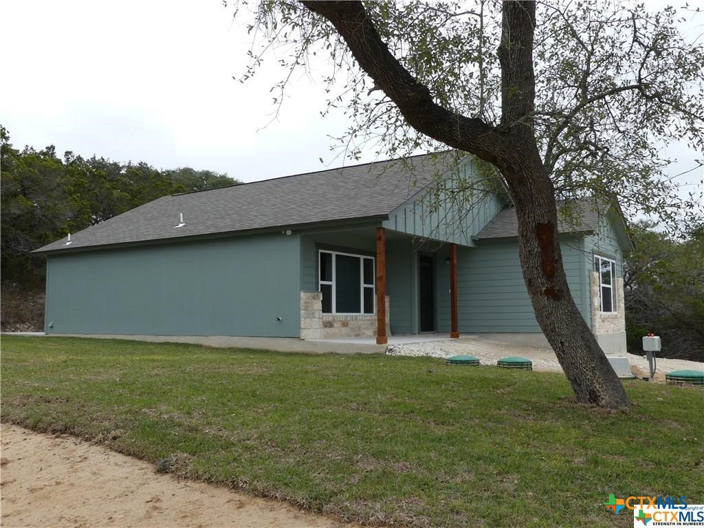 2455 Golf Drive Spring Branch, TX 78070 - Photo 3 of 24 a house that has a tree in front of a house