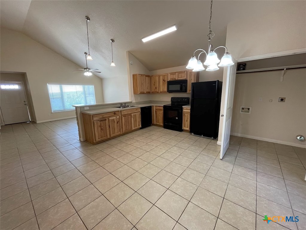 2455 Golf Drive Spring Branch, TX 78070 - Photo 4 of 24 a large kitchen with a large counter top stainless steel appliances and cabinets